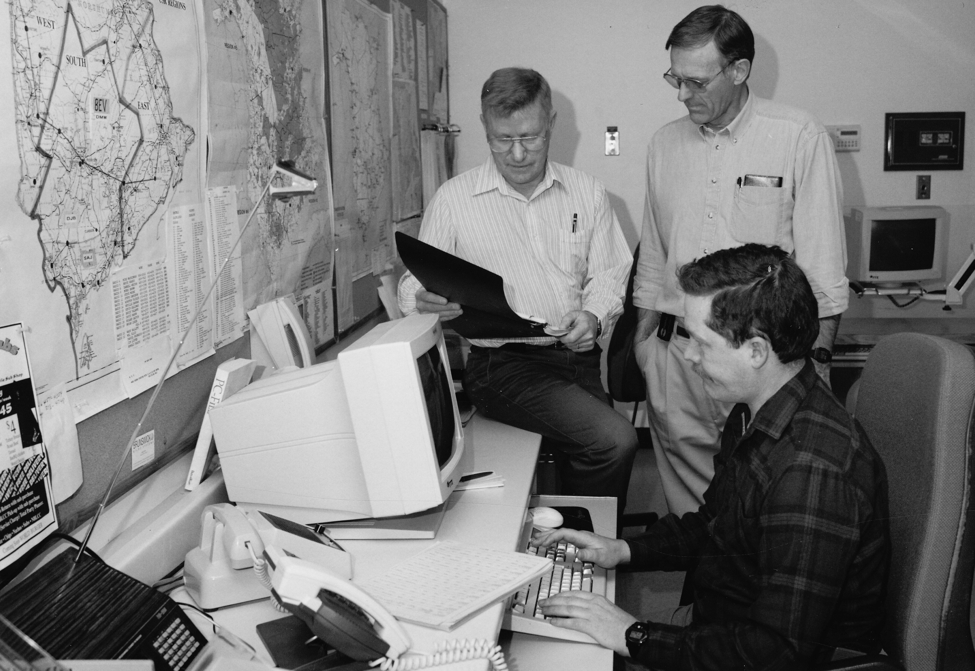 Murry Brown VE9MB (right) and Mel Ellis VE9KK (left) along with Greg Gilmore VE1XH (seated)