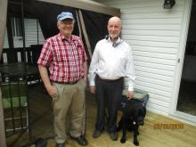 Paul Dixon VE1AIN with Jim Noseworthy VE1HJN and guide dog Orlando